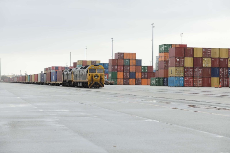 Freight train and shipping containers at an intermodal terminal in the Link WA precinct