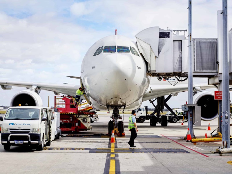 Aircraft being serviced on the tarmac, part of the precinct's air freight connection